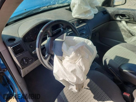 2007 Ford Focus S z VIN 1FAFP34N87W107744, wystawiony jako Copart lot #61934615 z przebiegiem Nie podano mil oraz Szkoda całkowita • Salvage title. Historia ofert i sprzedaży dostępna na DreamBid. Obrazek 9.
