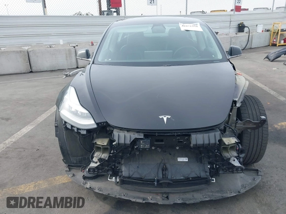 2020 Tesla Model 3 Long Range z VIN 5YJ3E1EB0LF600098, wystawiony jako IAAI lot #41071258 z przebiegiem 149 939 mil mil oraz . Historia ofert i sprzedaży dostępna na DreamBid. Obrazek 6.