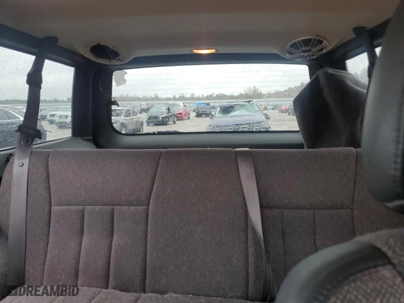 1999 Jeep Cherokee Sport with VIN 1J4FT68S1XL601799, listed as a Copart auction lot 83881844 with 203,572 mi miles and Salvage Title. Bid and sale history available at carsss.com. Image 10.