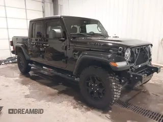 2022 Jeep Gladiator Willys Sport z VIN 1C6HJTAG2NL163338, wystawiony jako IAAI lot #41273645 z przebiegiem 14 031 mil mil oraz . Historia ofert i sprzedaży dostępna na DreamBid. Obrazek 1.