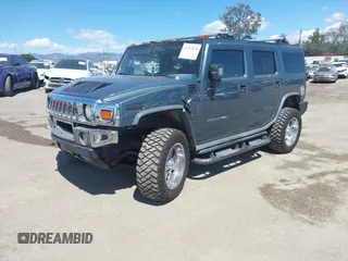 2005 Hummer H2 SUV with VIN 5GRGN23U35H105620, listed as a IAAI auction lot 41912574 with 232,938 mi miles. Bid and sale history available at carsss.com. Image 2.