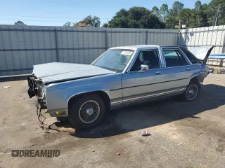 1989 Ford Crown Victoria z VIN 2FABP74F2KX141884, wystawiony jako Copart lot #74934494 z przebiegiem 84 761 mil mil oraz Szkody całkowita. Historia ofert i sprzedaży dostępna na DreamBid. Obrazek 1.