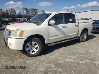 2005 Nissan Titan SE with VIN 1N6BA07B45N557451, listed as a Copart auction lot 80077824 with Not Provided miles and Salvage Title. Bid and sale history available at carsss.com. Image 1.