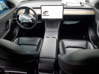 2021 Tesla Model Y Long Range with VIN 5YJYGDEE3MF214823, listed as a Copart auction lot 50738045 with 63,227 mi miles and Salvage Title. Bid and sale history available at DreamBid. Image 8.