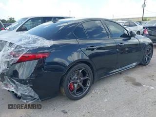 2023 Alfa Romeo Giulia Quadrifoglio with VIN ZARFAMEV9P7674979, listed as a IAAI auction lot 42514383 with 19,226 mi miles and . Bid and sale history available at DreamBid. Image 4.