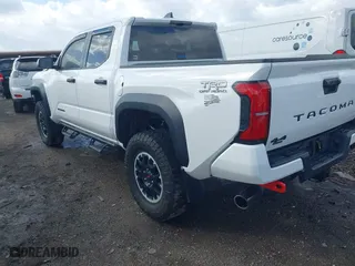 2024 Toyota Tacoma 4WD SR5 with VIN 3TYLB5JN8RT041814, listed as a IAAI auction lot 41714709 with 2,818 mi miles. Bid and sale history available at carsss.com. Image 3.