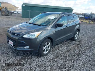 2016 Ford Escape SE with VIN 1FMCU9GX5GUA06660, listed as a IAAI auction lot 42043031 with 87,719 mi miles. Bid and sale history available at carsss.com. Image 17.