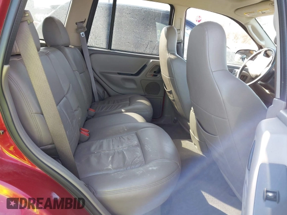 2003 Jeep Grand Cherokee Laredo with VIN 1J4GX48S13C594893, listed as a IAAI auction lot 41688597 with 179,680 mi miles. Bid and sale history available at carsss.com. Image 8.