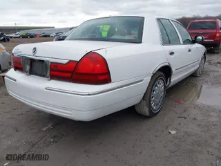 2004 Mercury Grand Marquis GS with VIN 2MEFM74W24X628573, listed as a IAAI auction lot 41922123 with 104,395 mi miles. Bid and sale history available at carsss.com. Image 4.