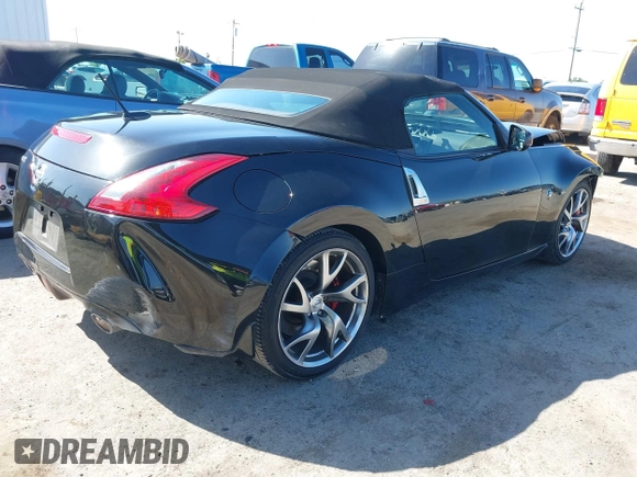 2014 Nissan 370Z Touring with VIN JN1AZ4FH8EM620208, listed as a IAAI auction lot 42094292 with 68,799 mi miles and . Bid and sale history available at DreamBid. Image 4.