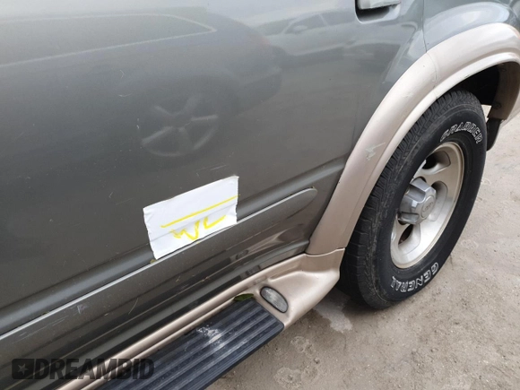 1999 Ford Explorer XL z VIN 1FMDU32E9XZB67958, wystawiony jako Copart lot #75350694 z przebiegiem 202 939 mil mil oraz Szkoda całkowita • Salvage title. Historia ofert i sprzedaży dostępna na DreamBid. Obrazek 13.