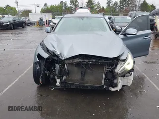2015 Infiniti Q50 Premium with VIN JN1BV7AR4FM393974, listed as a IAAI auction lot 41874345 with 148,228 mi miles. Bid and sale history available at carsss.com. Image 6.