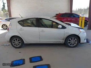 2012 Toyota Prius c One with VIN JTDKDTB35C1015176, listed as a IAAI auction lot 42053659 with 94,565 mi miles. Bid and sale history available at carsss.com. Image 13.