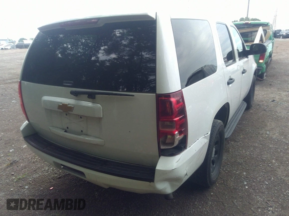 2013 Chevrolet Tahoe Commercial with VIN 1GNLC2E05DR351035, listed as a IAAI auction lot 42641974 with 265,608 mi miles and . Bid and sale history available at DreamBid. Image 4.