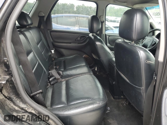 2004 Ford Escape Limited with VIN 1FMCU04164KB51256, listed as a Copart auction lot 58969565 with 137,360 mi miles and Salvage title. Bid and sale history available at DreamBid. Image 11.