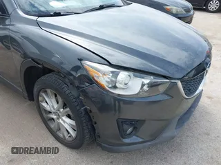 2014 Mazda CX-5 Grand Touring with VIN JM3KE2DY0E0354220, listed as a IAAI auction lot 41885502 with 168,901 mi miles. Bid and sale history available at carsss.com. Image 6.
