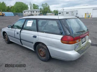 1998 Subaru Legacy L z VIN 4S3BK4353W7300794, wystawiony jako IAAI lot #42205793 z przebiegiem 227 539 mil mil oraz . Historia ofert i sprzedaży dostępna na DreamBid. Obrazek 3.