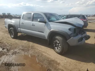 2021 Toyota Tacoma SR5 with VIN 3TMDZ5BN9MM099515, listed as a Copart auction lot 56687385 with 66,721 mi miles and Salvage title. Bid and sale history available at DreamBid. Image 4.