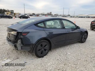 2022 Tesla Model 3 Long Range with VIN 5YJ3E1EB0NF269249, listed as a Copart auction lot 87318524 with 18,406 mi miles and Salvage Title. Bid and sale history available at DreamBid. Image 3.