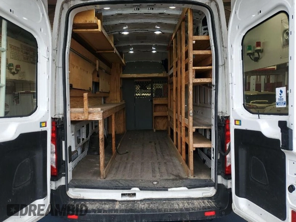 2019 Ford Transit Cargo with VIN 1FTBW3XG4KKA67980, listed as a IAAI auction lot 42110182 with 181,706 mi miles. Bid and sale history available at carsss.com. Image 1.
