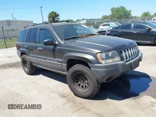 2004 Jeep Grand Cherokee Laredo z VIN 1J4GW48S24C414311, wystawiony jako IAAI lot #41878631 z przebiegiem 172 396 mil mil oraz . Historia ofert i sprzedaży dostępna na DreamBid. Obrazek 1.