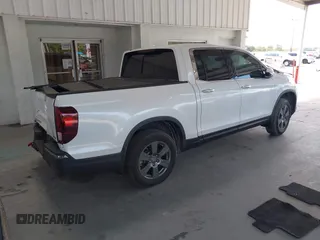 2020 Honda Ridgeline RTL-E with VIN 5FPYK3F71LB005028, listed as a IAAI auction lot 42167883 with 81,882 mi miles and . Bid and sale history available at DreamBid. Image 4.