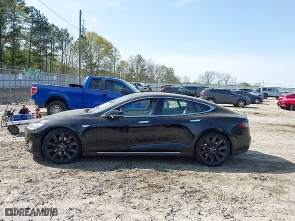 2015 Tesla Model S 85 kWh Battery with VIN 5YJSA1S11FFP79033, listed as a IAAI auction lot 41924740 with NaN miles. Bid and sale history available at carsss.com. Image 15.