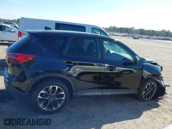 2016 Mazda CX-5 Grand Touring with VIN JM3KE4DY4G0677605, listed as a IAAI auction lot 41642893 with Not Provided miles and . Bid and sale history available at carsss.com. Image 13.