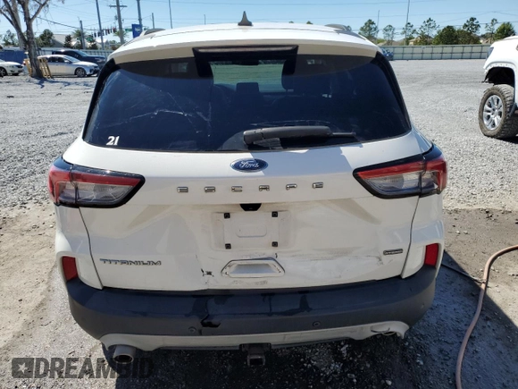 2021 Ford Escape Titanium Hybrid z VIN 1FMCU0DZ5MUB04522, wystawiony jako Copart lot #49127385 z przebiegiem 66 996 mil mil oraz Szkody całkowita. Historia ofert i sprzedaży dostępna na DreamBid. Obrazek 6.