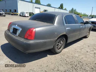 2001 Lincoln Town Car Cartier L z VIN 1LNHM85W71Y624315, wystawiony jako Copart lot #60479385 z przebiegiem 171 485 mil mil oraz Czysty tytuł • Clean title. Historia ofert i sprzedaży dostępna na DreamBid. Obrazek 3.