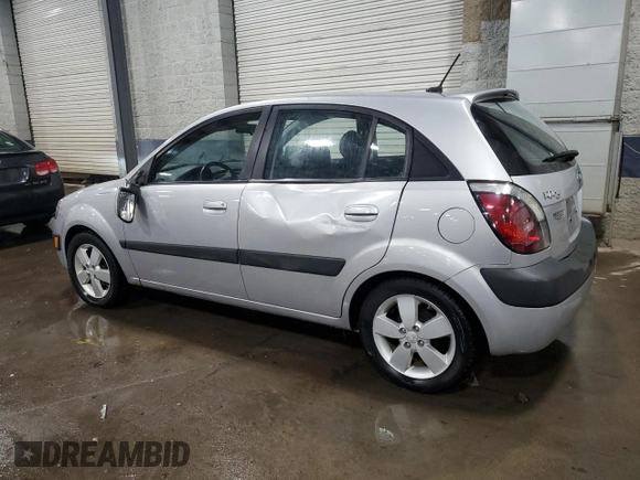 2009 Kia Rio LX with VIN KNADE243196496923, listed as a Copart auction lot 44235725 with 103,171 mi miles and Salvage Title. Bid and sale history available at carsss.com. Image 2.