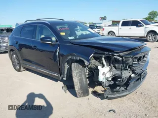 2016 Mazda CX-9 Grand Touring with VIN JM3TCADY6G0107064, listed as a IAAI auction lot 42580485 with 124,713 mi miles and . Bid and sale history available at DreamBid. Image 1.