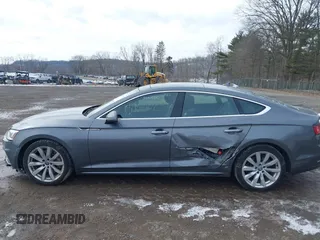 2018 Audi A5 Sportback Premium Plus z VIN WAUBNCF52JA124956, wystawiony jako IAAI lot #41606230 z przebiegiem 100 067 mil mil oraz . Historia ofert i sprzedaży dostępna na DreamBid. Obrazek 14.