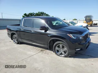 2023 Honda Ridgeline RTL-E with VIN 5FPYK3F72PB001592, listed as a Copart auction lot 52154625 with 41,153 mi miles and Salvage title. Bid and sale history available at DreamBid. Image 4.