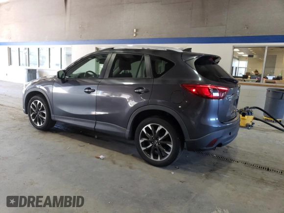 2016 Mazda CX-5 Grand Touring with VIN JM3KE4DY8G0616421, listed as a Copart auction lot 50884525 with 182,048 mi miles and Salvage Title. Bid and sale history available at DreamBid. Image 2.