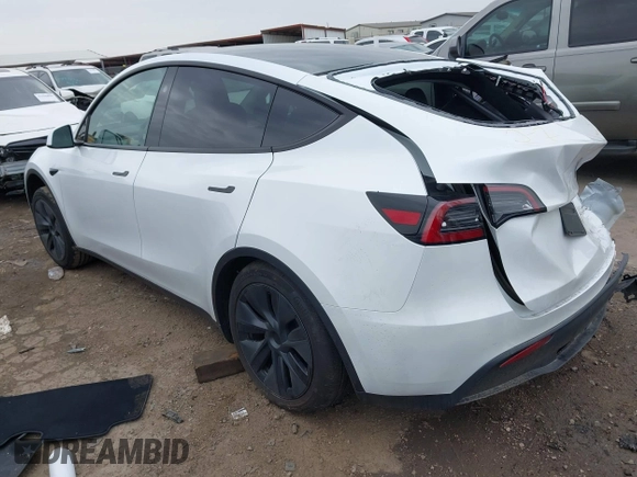 2025 Tesla Model Y Long Range z VIN 7SAYGDED9SA357876, wystawiony jako IAAI lot #41555227 z przebiegiem 1 600 mil mil oraz . Historia ofert i sprzedaży dostępna na DreamBid. Obrazek 3.
