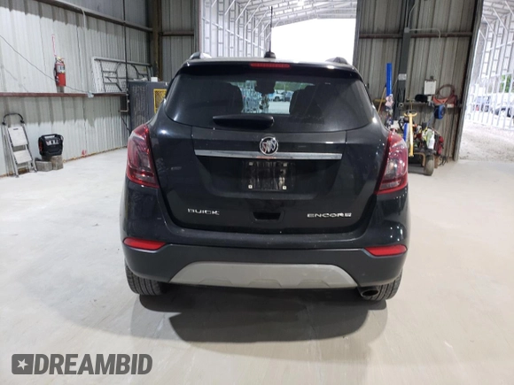 2018 Buick Encore Preferred with VIN KL4CJASB2JB665917, listed as a Copart auction lot 52952515 with 93,036 mi miles and Salvage Title. Bid and sale history available at DreamBid. Image 6.
