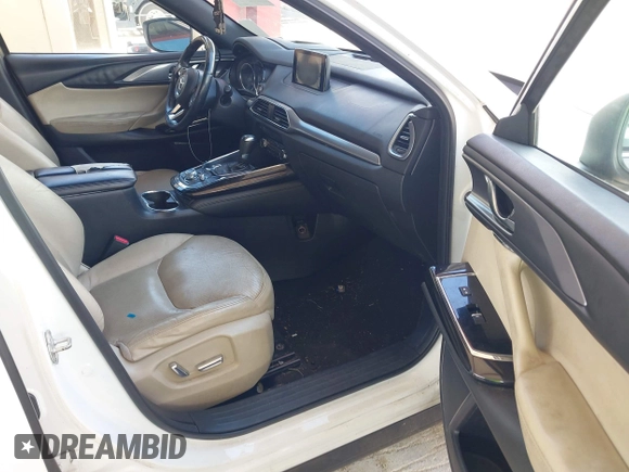 2016 Mazda CX-9 Grand Touring with VIN JM3TCADYXG0113563, listed as a IAAI auction lot 42593120 with 237,696 mi miles and . Bid and sale history available at DreamBid. Image 5.
