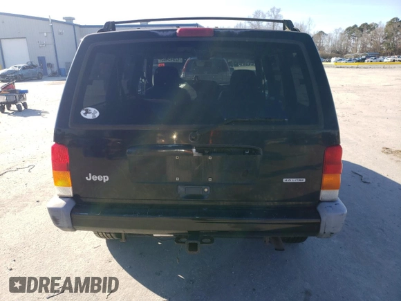 2000 Jeep Cherokee Classic with VIN 1J4FF58S3YL171454, listed as a Copart auction lot 42945485 with 218,721 mi miles and Salvage Title. Bid and sale history available at carsss.com. Image 6.