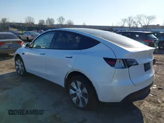 2023 Tesla Model Y Long Range z VIN 7SAYGDEE5PF765326, wystawiony jako IAAI lot #41757113 z przebiegiem 10 461 mil mil oraz . Historia ofert i sprzedaży dostępna na DreamBid. Obrazek 3.
