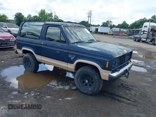 1986 Ford Bronco z VIN 1FMCU14T1GUB85931, wystawiony jako IAAI lot #42522261 z przebiegiem 57 870 mil mil oraz . Historia ofert i sprzedaży dostępna na DreamBid. Obrazek 1.