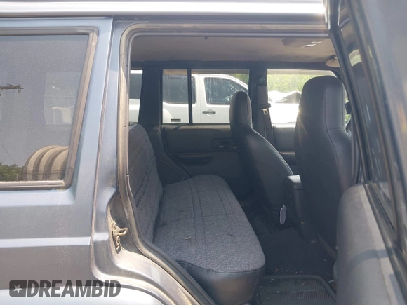 2001 Jeep Cherokee Sport z VIN 1J4FF48S51L531033, wystawiony jako IAAI lot #42423910 z przebiegiem 90 438 mil mil oraz . Historia ofert i sprzedaży dostępna na DreamBid. Obrazek 8.