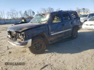 2002 GMC Yukon SLT with VIN 1GKEK13Z62J148557, listed as a Copart auction lot 43246075 with 242,968 mi miles and Salvage Title. Bid and sale history available at carsss.com. Image 1.