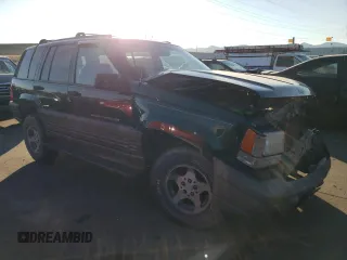 1997 Jeep Grand Cherokee Laredo with VIN 1J4GZ58Y6VC647434, listed as a Copart auction lot 73496824 with 124,946 mi miles and Salvage Title. Bid and sale history available at carsss.com. Image 4.