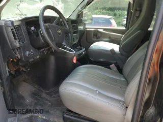 2015 Chevrolet Express Passenger LS with VIN 1GAWGPFG0F1141701, listed as a Copart auction lot 62818685 with 63,219 mi miles and Salvage title. Bid and sale history available at DreamBid. Image 7.
