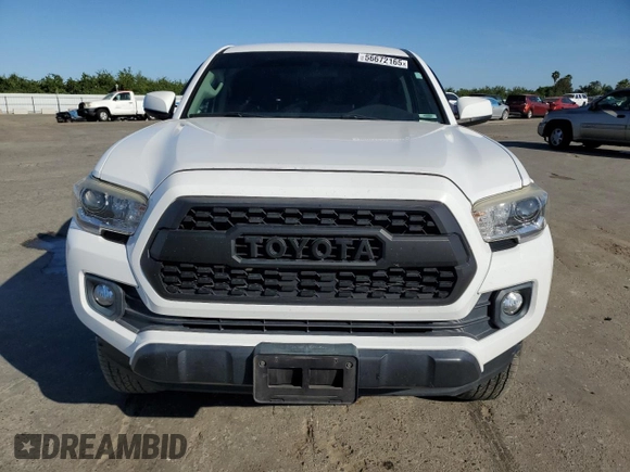 2017 Toyota Tacoma SR z VIN 5TFAX5GNXHX074690, wystawiony jako Copart lot #56672165 z przebiegiem 107 292 mil mil oraz Szkoda całkowita • Salvage title. Historia ofert i sprzedaży dostępna na DreamBid. Obrazek 5.