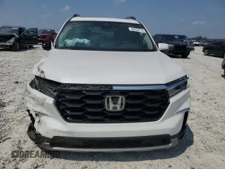 2023 Honda Pilot Touring with VIN 5FNYG2H77PB014212, listed as a Copart auction lot 59222715 with 4,507 mi miles and Salvage title. Bid and sale history available at DreamBid. Image 5.