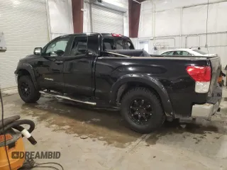 2010 Toyota Tundra 4WD Truck with VIN 5TFUM5F11AX006501, listed as a Copart auction lot 42424145 with 239,553 mi miles and Salvage Title. Bid and sale history available at carsss.com. Image 2.