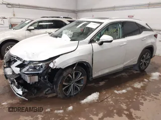 2021 Lexus RX with VIN 2T2HGMDA6MC064446, listed as a IAAI auction lot 41108859 with 116,930 mi miles. Bid and sale history available at carsss.com. Image 2.