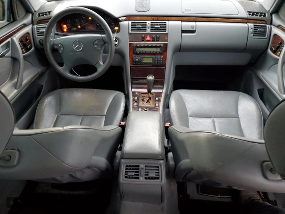 2000 Mercedes-Benz E-Class with VIN WDBJF65J8YB153103, listed as a Copart auction lot 80986234 with 144,205 mi miles and Salvage Title. Bid and sale history available at carsss.com. Image 8.